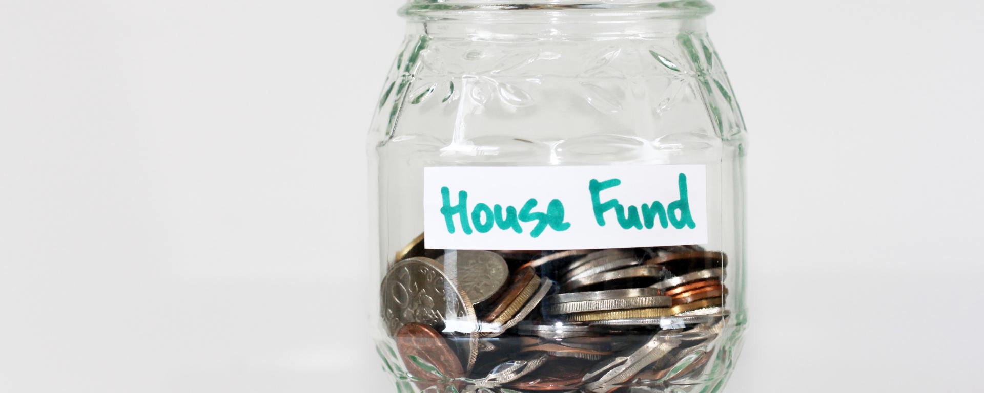 Picture of coins in glass jar. Photo by Sandy Millar on Unsplash