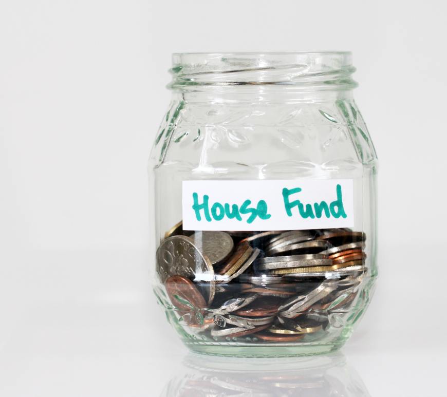 Picture of coins in glass jar. Photo by Sandy Millar on Unsplash
